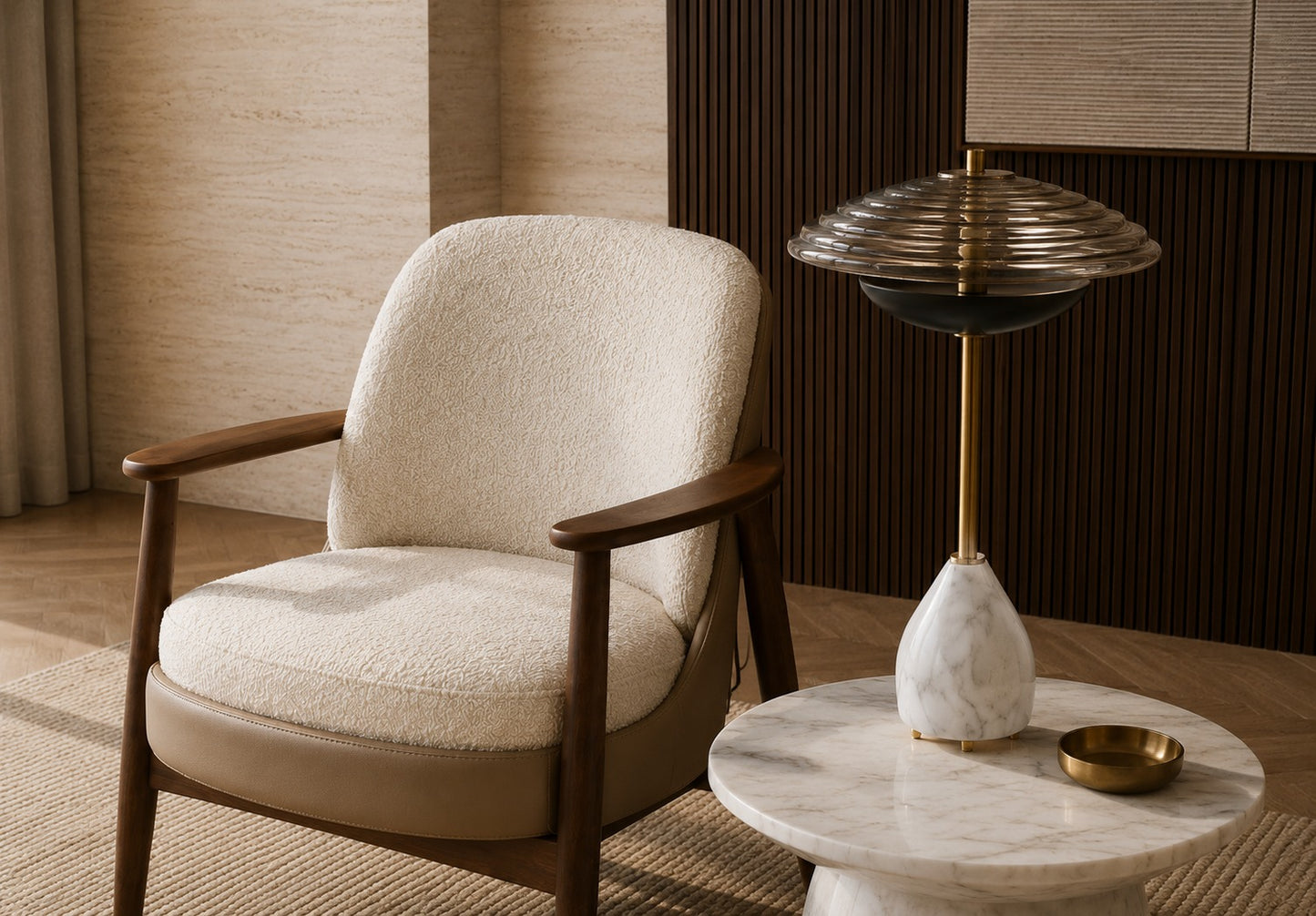 Beige armchair with wooden arms and legs in a room with a marble side table and decorative lamp.