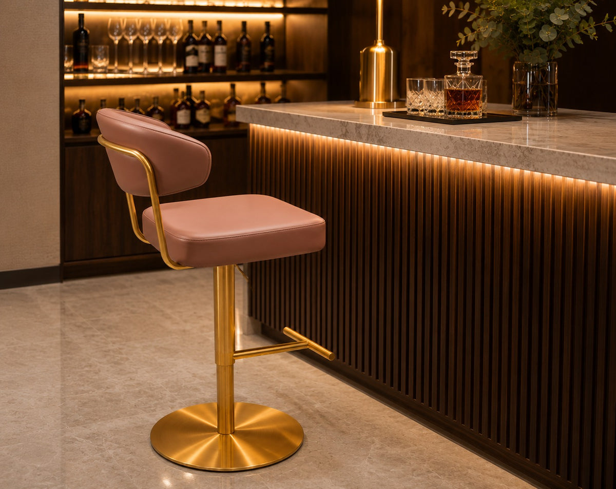 Pink bar stool with gold base in a modern bar setting