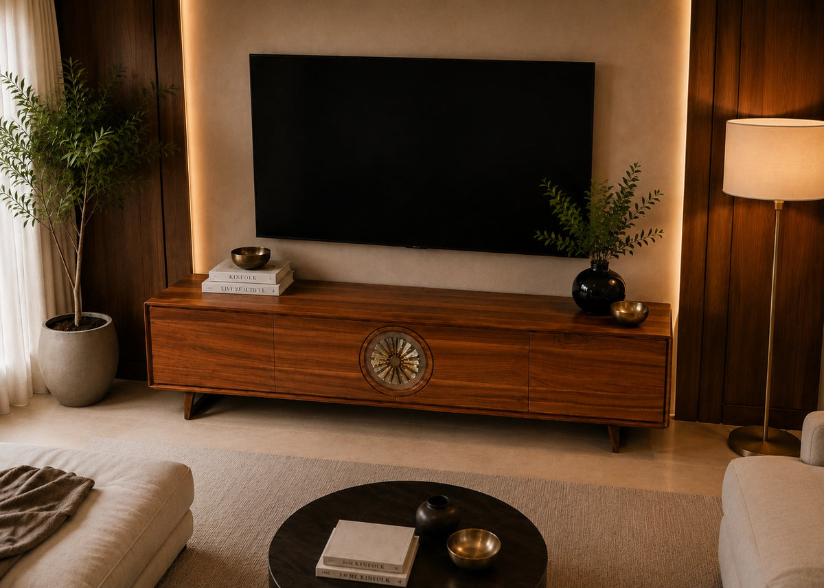 Wooden TV stand with a television in a living room setting.