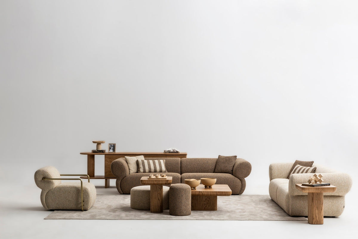 Texturemaxxing luxury living room with layered upholstery wood stone and tactile materials