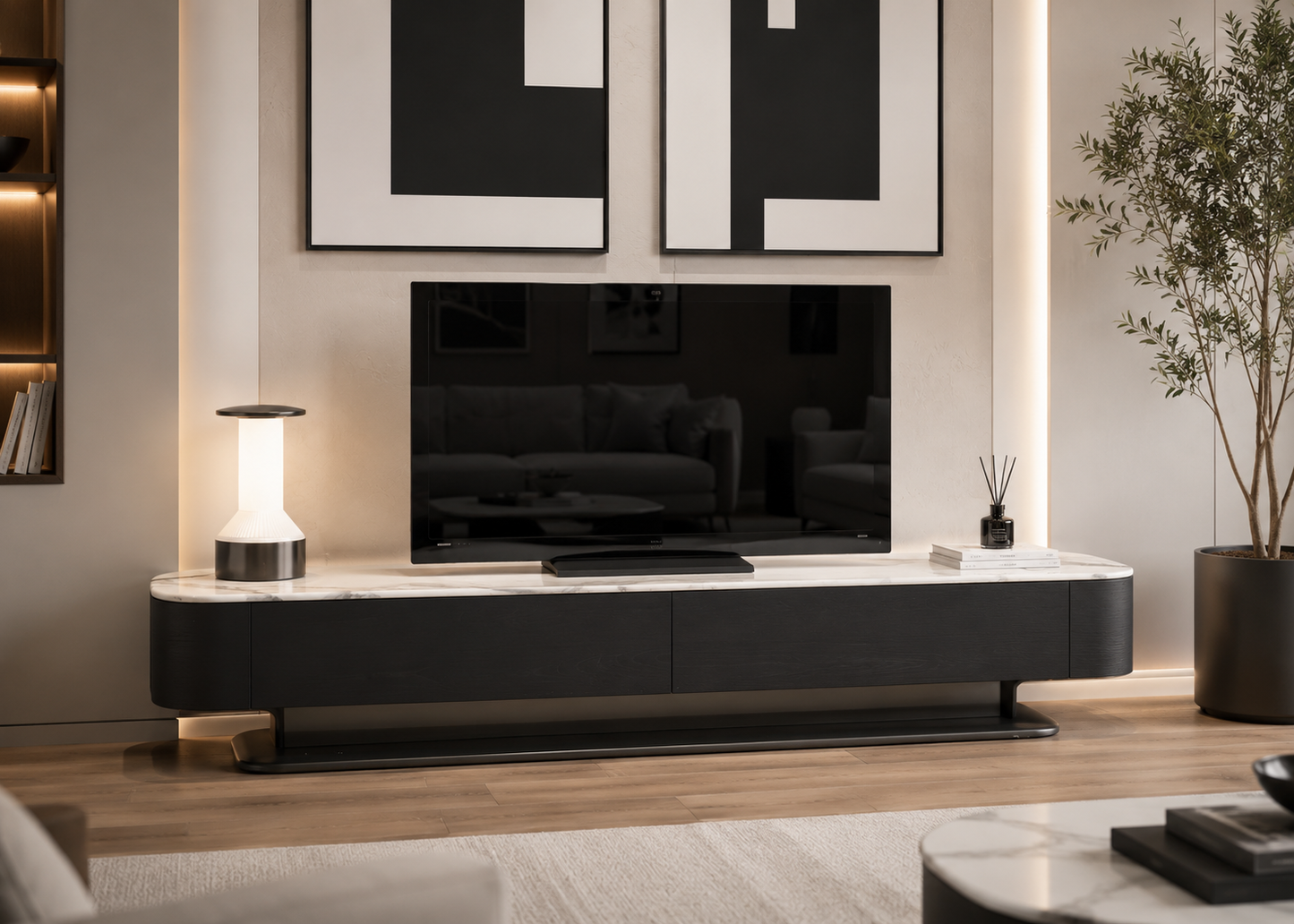 A modern floating TV console in black with a white marble-look top, shown in a styled living room setting with a television, lamp, and wall art.