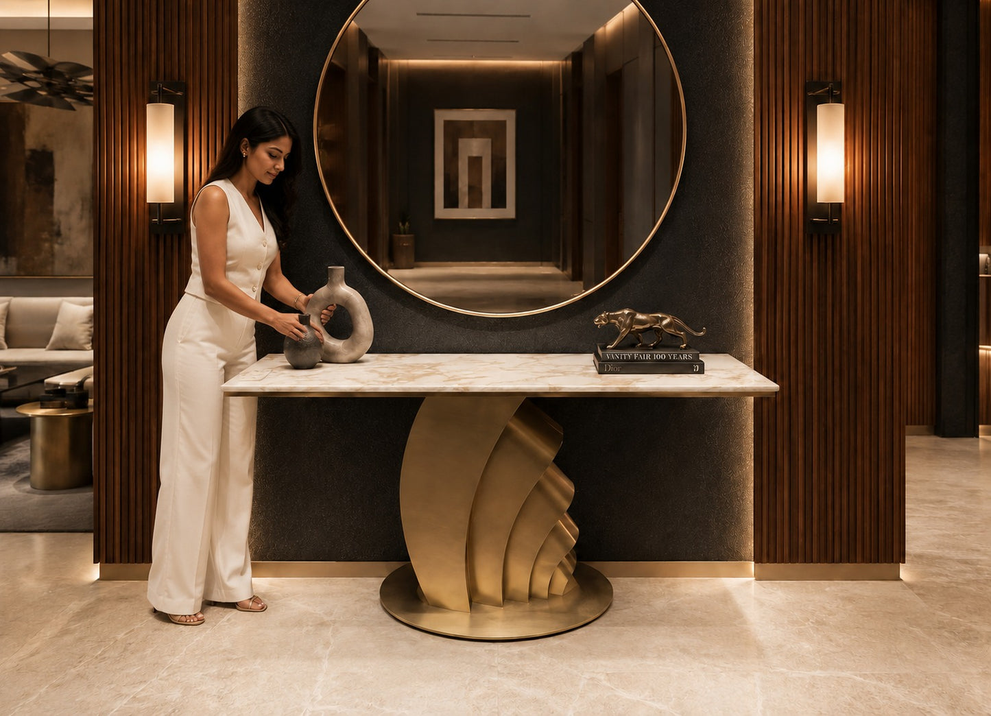 Woman in a stylish interior setting with a large mirror and decorative items.