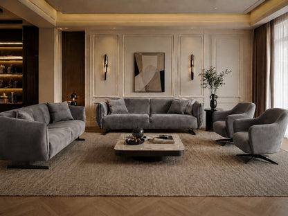 Modern living room with gray sofa, coffee table, and decorative elements.