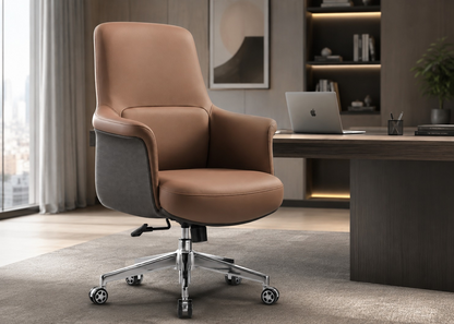 A modern office chair with a tan leather seat and backrest, gray fabric armrests, and a chrome five-star wheeled base, positioned in a contemporary home office next to a wooden desk.
