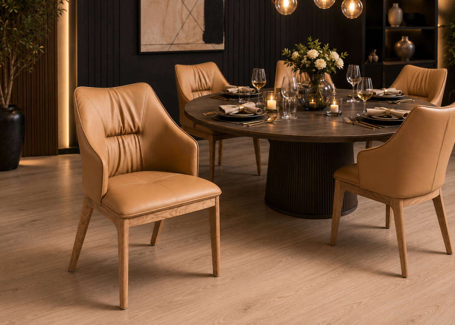 A set of modern dining chairs with tan leather upholstery and light wood legs, arranged around a round dark wood dining table in a contemporary dining room setting.