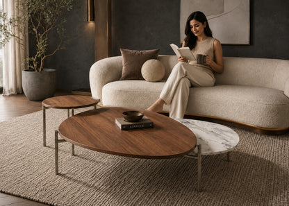 Woman reading a book on a modern sofa in a stylish living room.