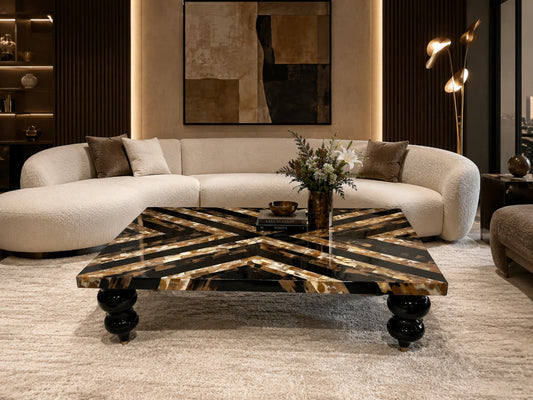 Modern living room with a stylish coffee table and beige sofa.