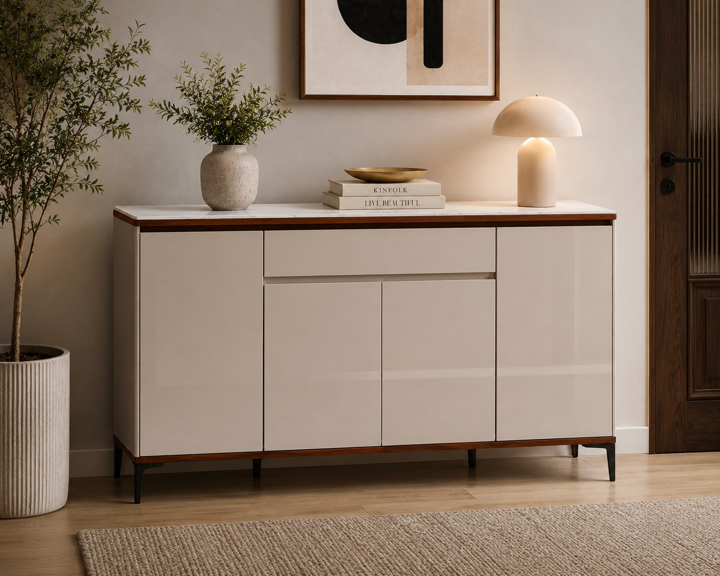 Beige sideboard with wooden accents in a room with a plant and framed artwork.