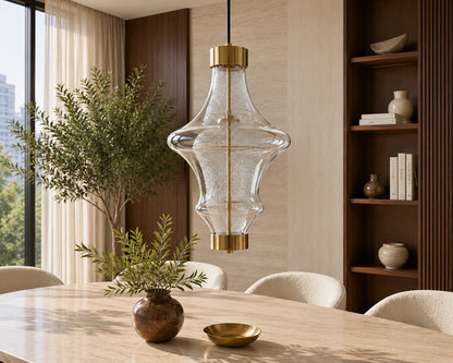Modern dining room with a stylish pendant light, table, chairs, and decorative elements.