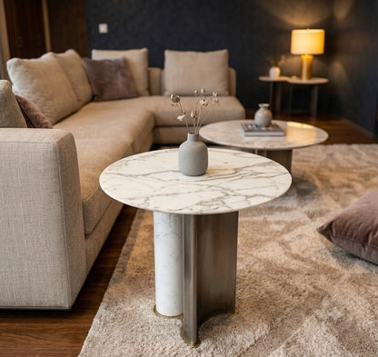 Modern living room with a marble coffee table and beige sofa.