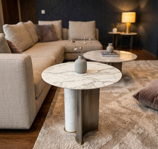 Modern living room with a marble coffee table and beige sofa.