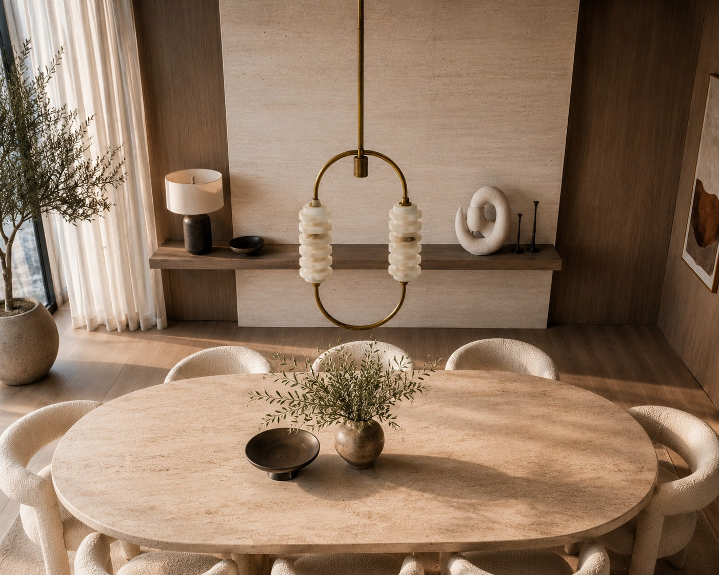 Dining room with wooden table and chairs, decorative elements, and a lamp.