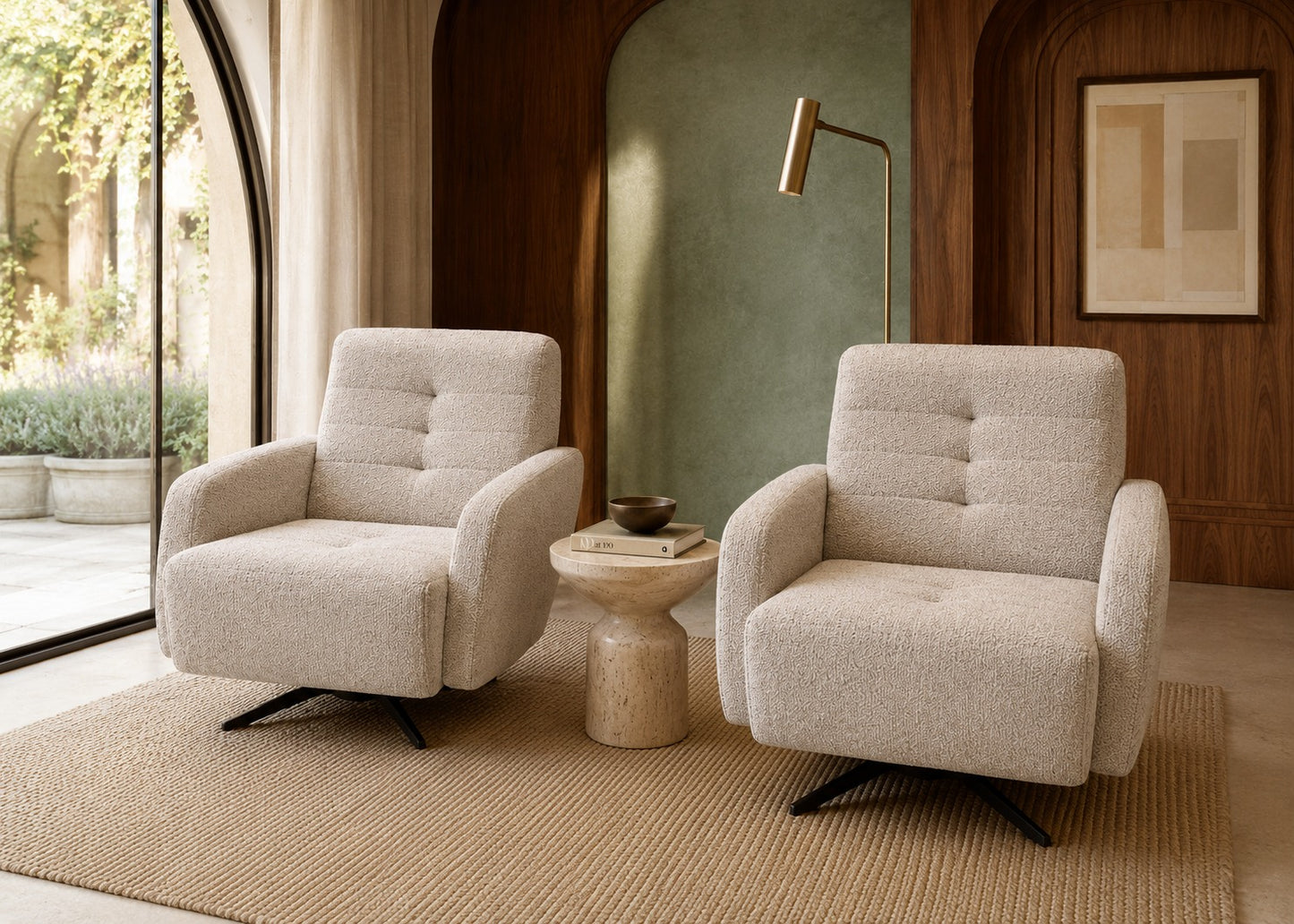 Two beige armchairs in a modern living room with a side table and lamp.