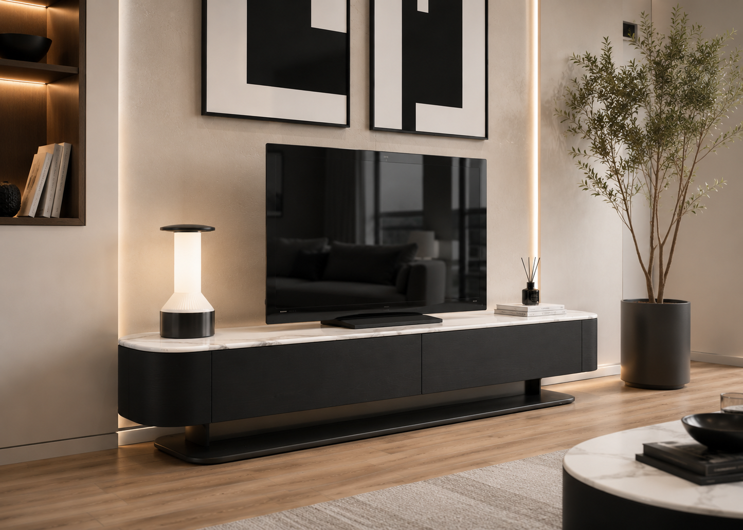 A modern black floating TV console with a white marble-look top, styled in a contemporary living room with a television, a table lamp, wall art, and a potted plant.