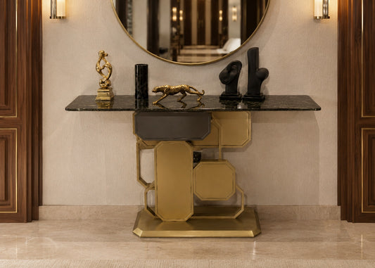 Decorative console table with gold and black design in a room setting.