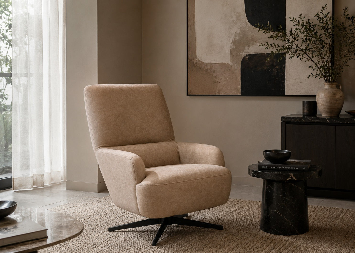 Beige armchair in a modern living room with abstract art and decor.