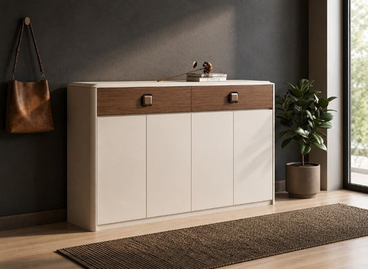 A modern sideboard cabinet with a cream-colored body and a dark wood top drawer section, styled in a contemporary room with a dark gray wall, a potted plant, and a window.