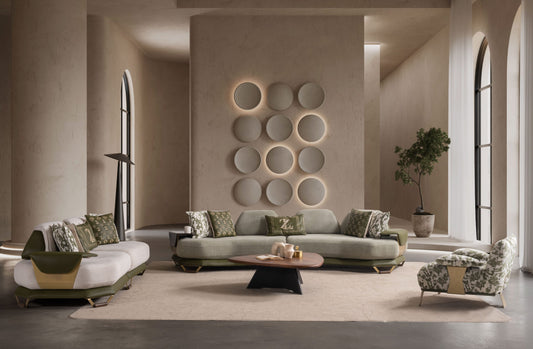 Etna modern curved sofa featuring textured sage green upholstery with sleek brushed gold metal side plating in a luxury contemporary living room.