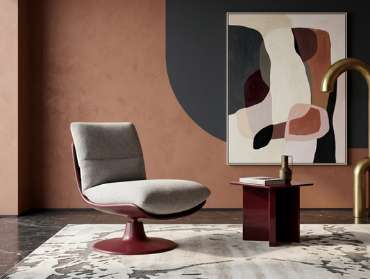 Modern interior with a gray chair, abstract painting, and side table.