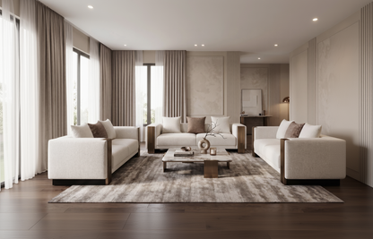 Modern living room with beige sofas, coffee table, and decorative items.