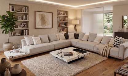 Modern living room with a sectional sofa, coffee table, and decorative items.