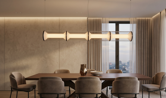 Modern dining room with a long wooden table and chairs, featuring a large pendant light and large windows.