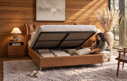 Alba Hand-Knit Leather Bed with hydraulic lift-up storage open, showing organized under-bed storage