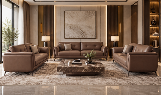 Rovelle three-piece pure leather sofa set in granite brown in a formal luxury living room with marble coffee table