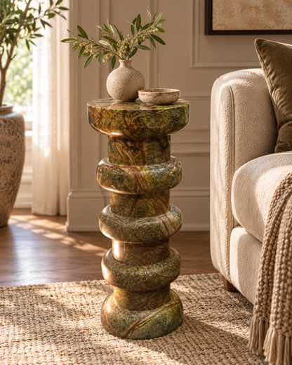 Verde Ritmo sculptural marble pedestal with olive green and rust-brown veining, stacked circular tiers and curated vase styling in luxury home