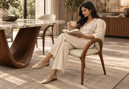 Ayla Dining Chair with seated woman in warm contemporary dining room