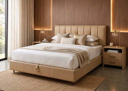 A modern platform bed with a tufted beige upholstered headboard and matching base, dressed in white bedding with a beige throw blanket. The bed is styled in a contemporary bedroom with a wood-paneled wall, warm ambient lighting, two matching nightstands, and a woven rug.