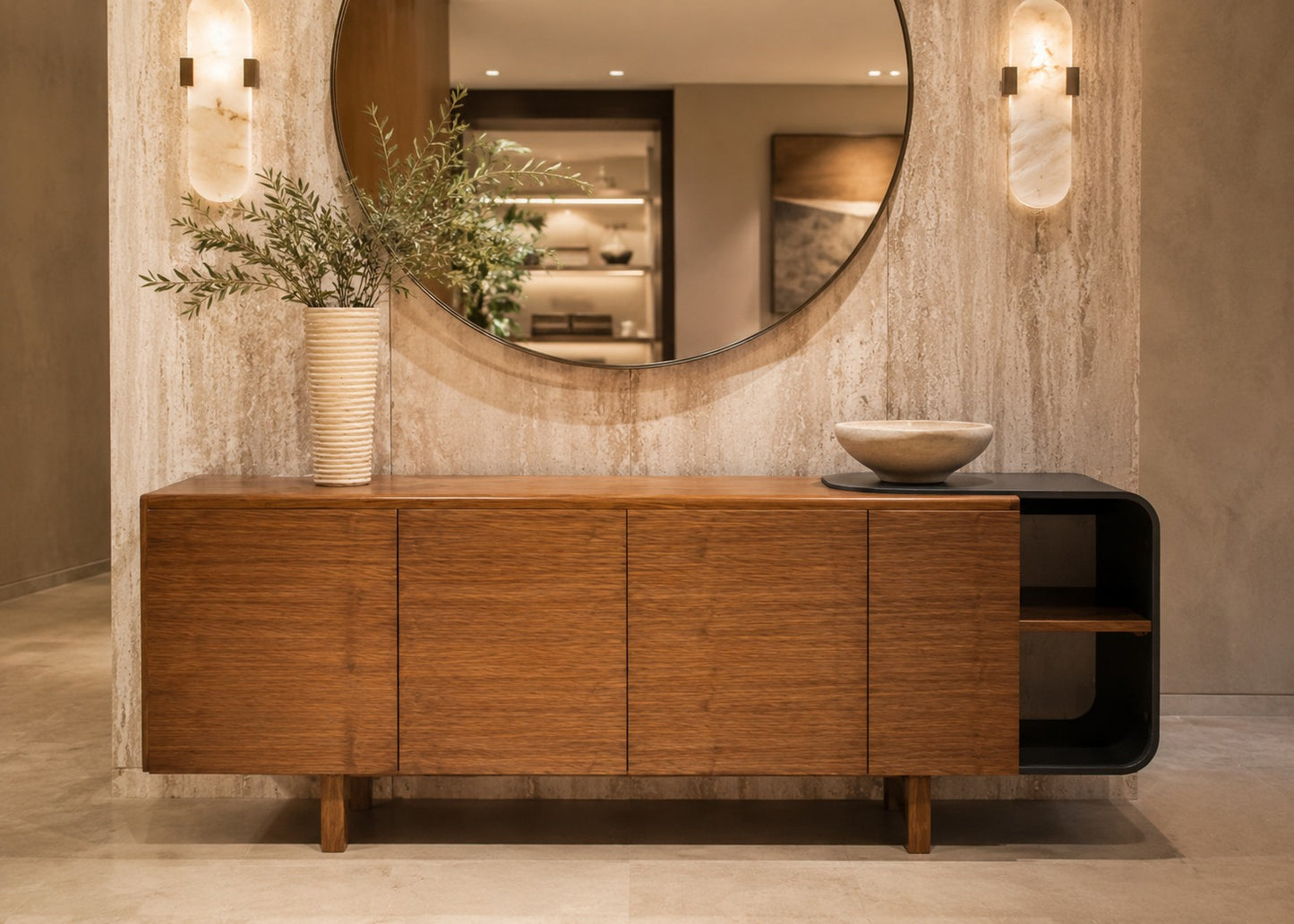 Wooden sideboard with decorative items in a room with a large mirror and wall lights.