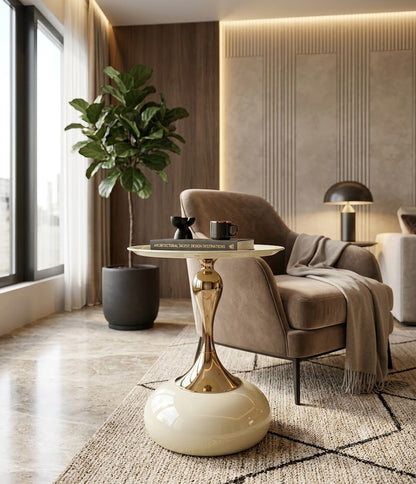 Modern living room with a gold side table, brown armchair, and decorative plant.