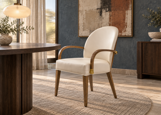 Calora ivory leatherette chair with curved wooden arms and gold accents