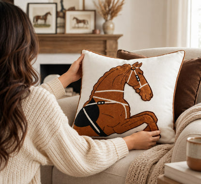 Cheval Equestrian Cushion being arranged in a warm luxury living room