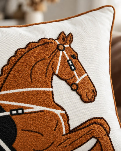 Close-up of the rust horse embroidery and velvet texture on the Cheval Equestrian Cushion
