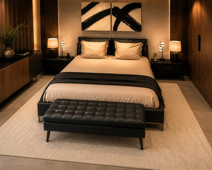 Modern bedroom with a bed, nightstands, and a bench.