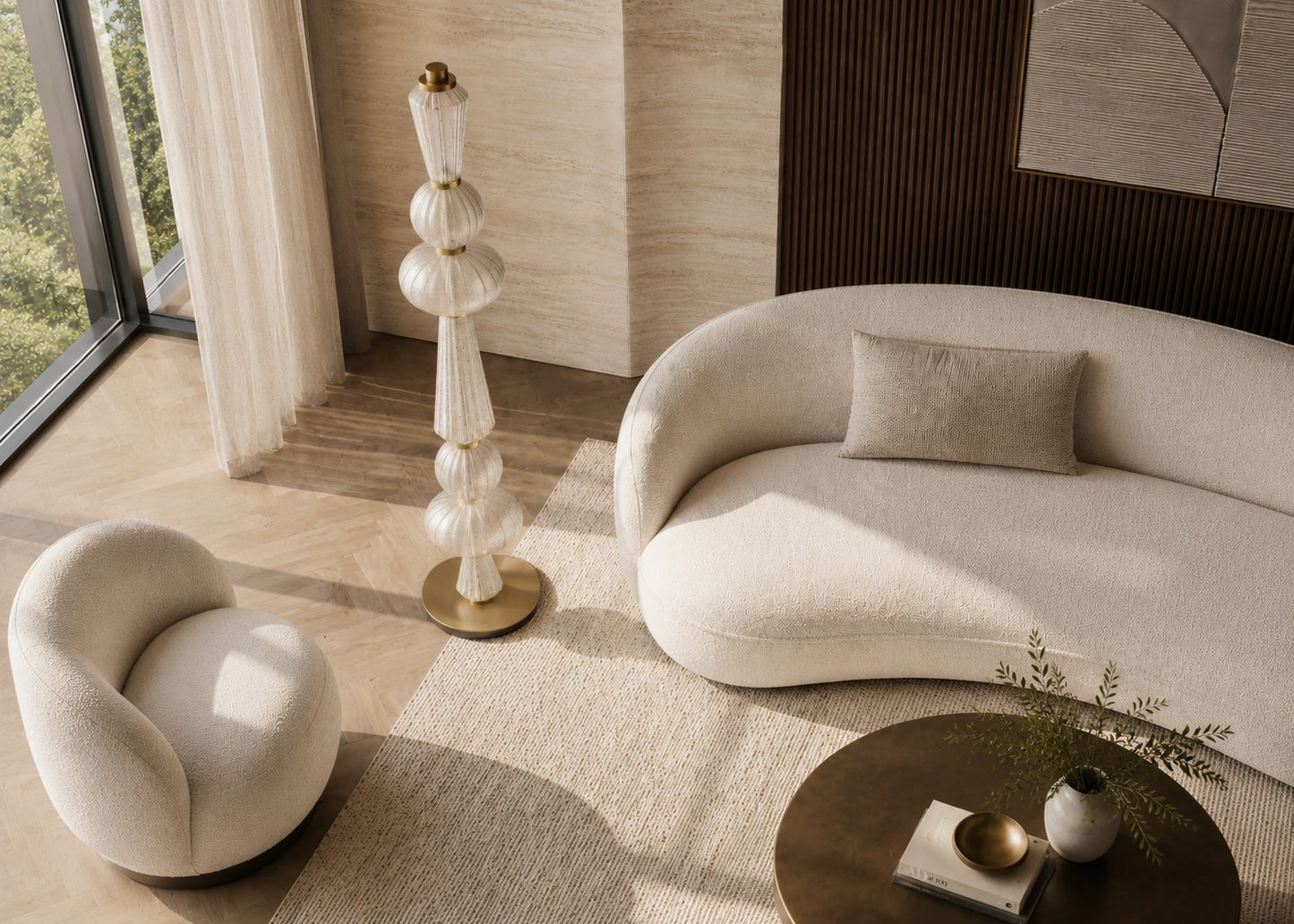 Modern living room with a beige sofa, armchair, and decorative floor lamp.