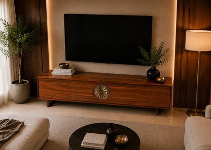 Wooden TV stand with a television in a living room setting.
