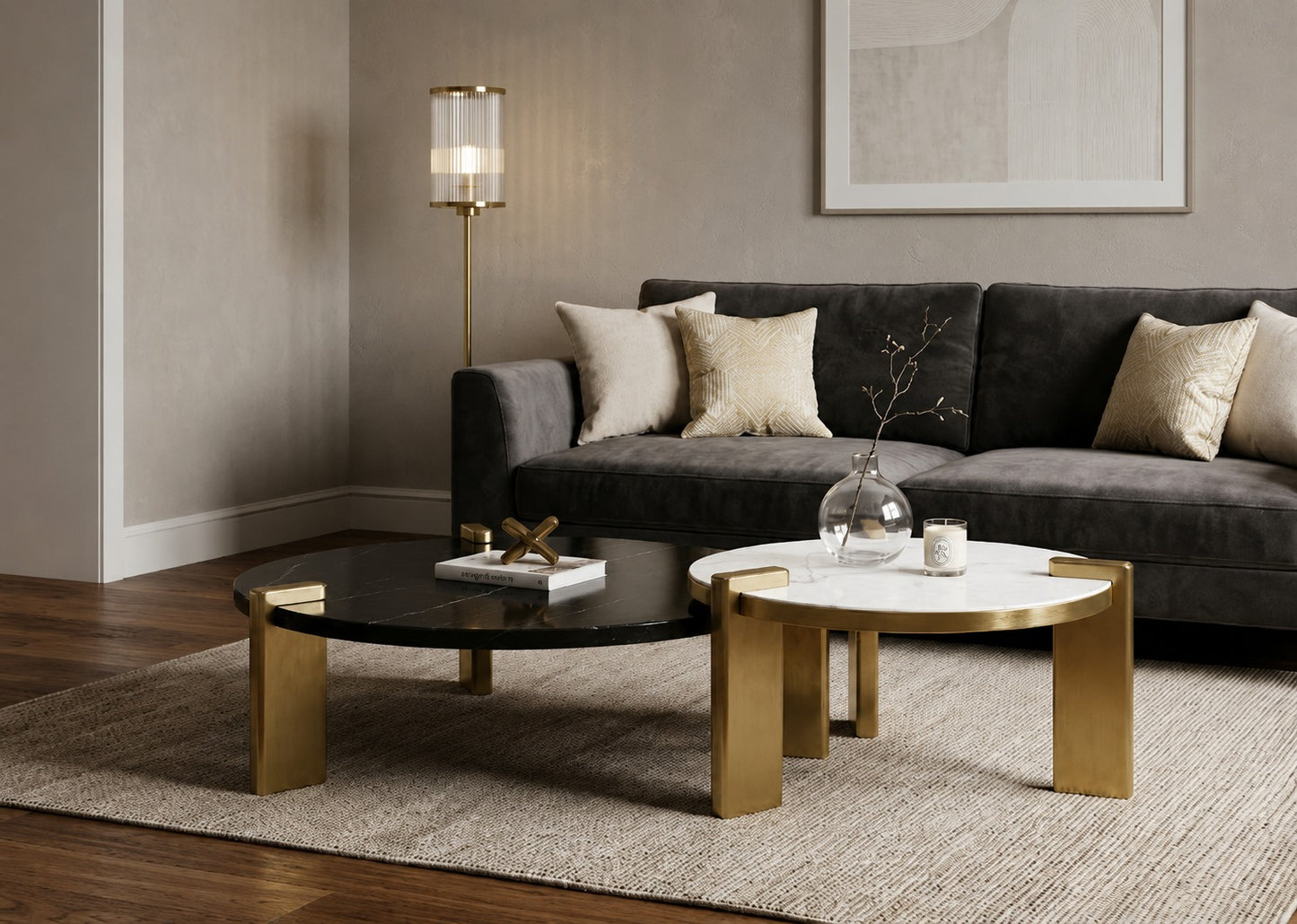 Modern living room with a gray sofa, gold coffee table, and decorative items.