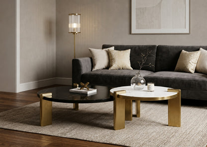 Modern living room with a gray sofa, gold coffee table, and decorative items.