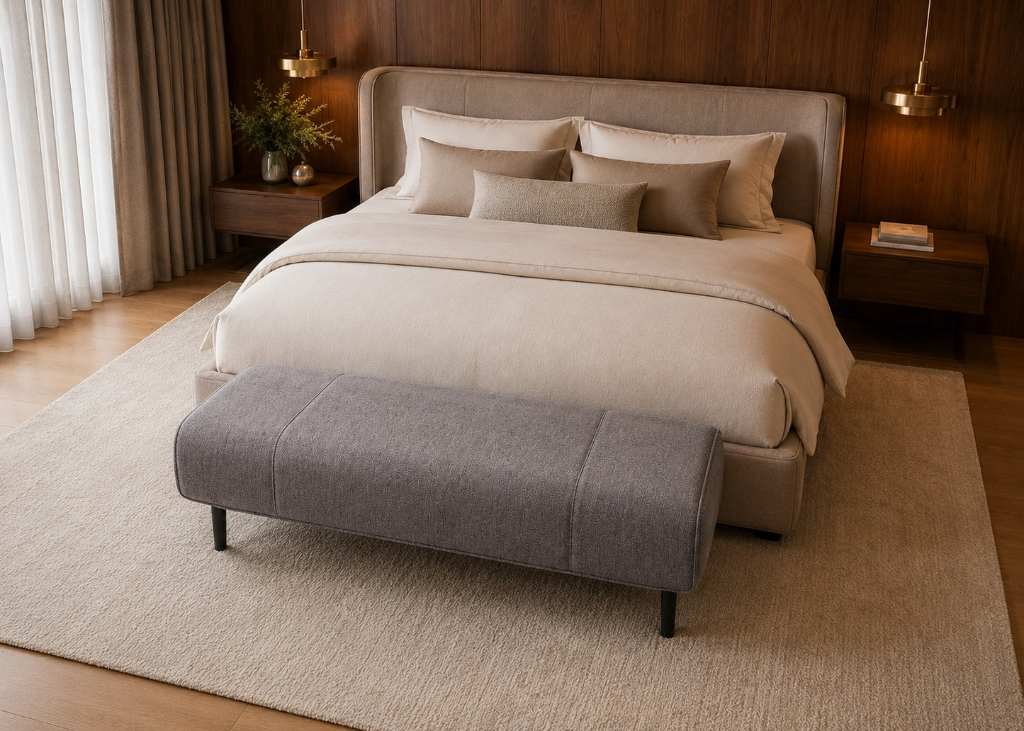 Beige upholstered bed with matching bench in a bedroom setting