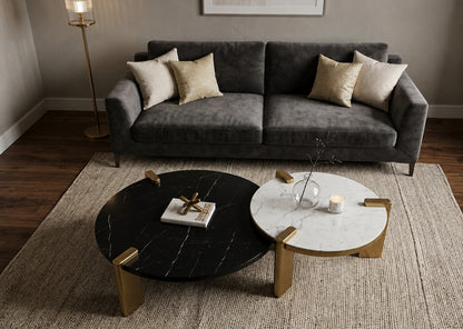 Gray sofa with decorative pillows in a living room setting with two coffee tables.