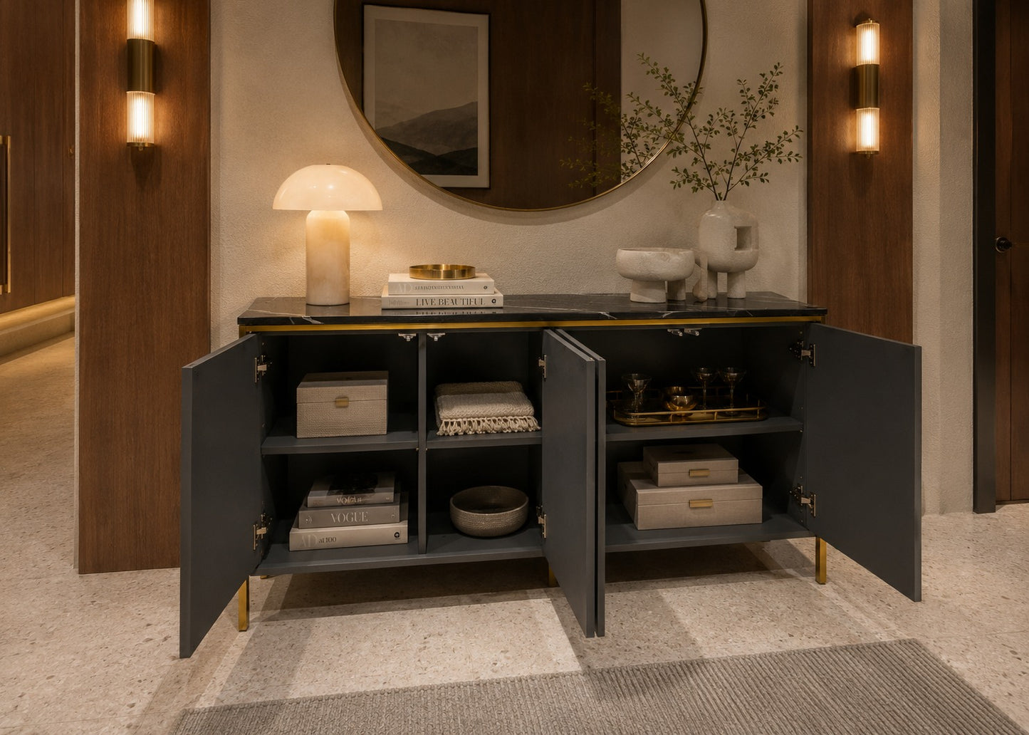 Modern interior with a dark gray sideboard, decorative items, and wall lights.
