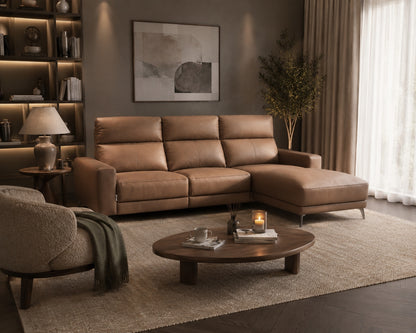 Brown sectional sofa in a living room with a coffee table and decorative items.