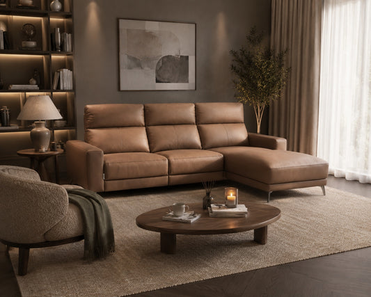 Brown sectional sofa in a living room with a coffee table and decorative items.