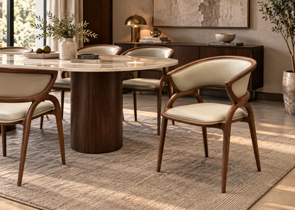 Elara Dining Chair in solid walnut wood and ivory vegan leather in a luxury dining room