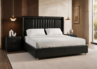 Modern bedroom with a black upholstered bed and white bedding.