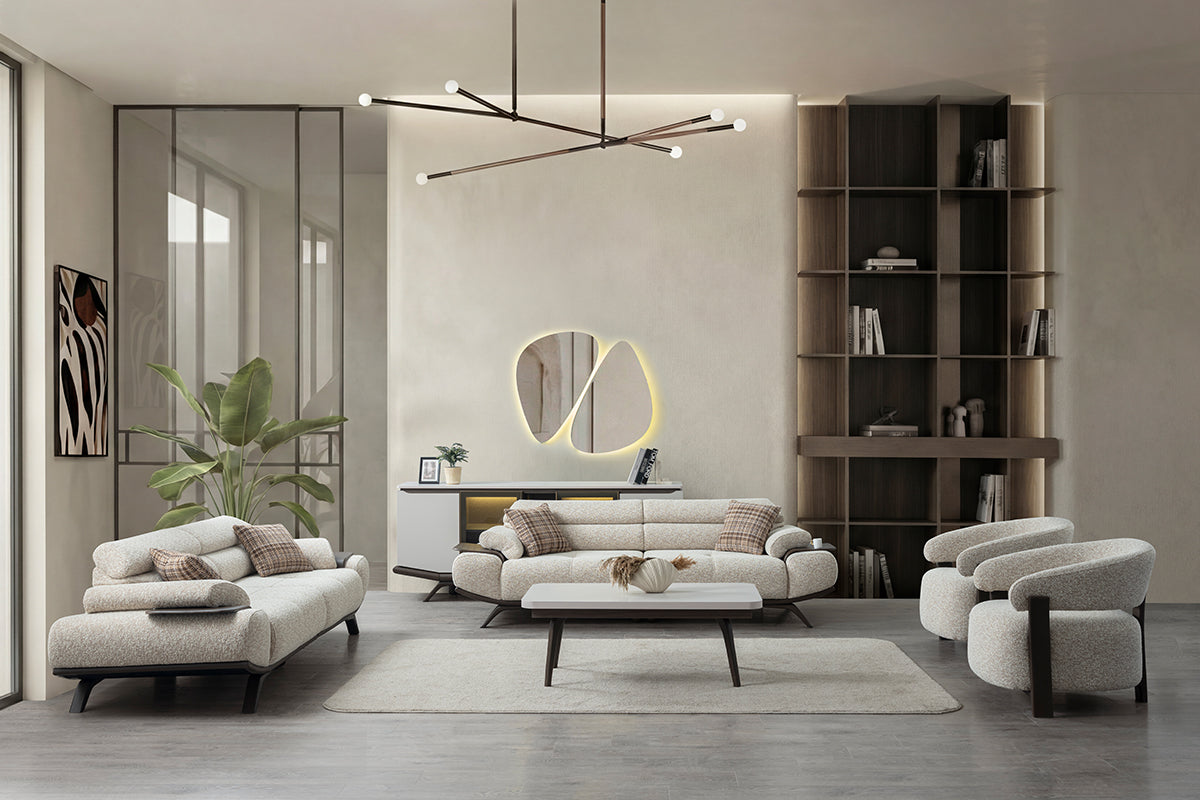 Modern living room with gray sofa, bookshelf, and decorative items.