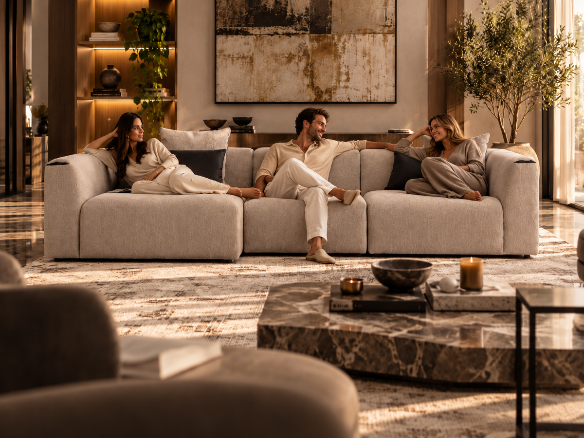 Soho L-shape beige left-chaise sectional sofa in luxury warm living room with three casually relaxing adults, demonstrating generous seating